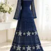 Navy crochet lace dress with silver star appliqués displayed on a dress form, showing mesh bodice and flared skirt with scalloped hem